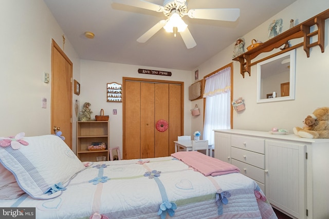 bedroom with ceiling fan and a closet