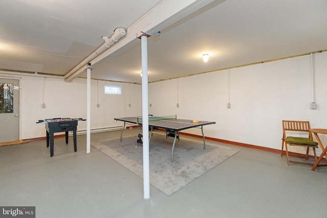 game room with concrete flooring