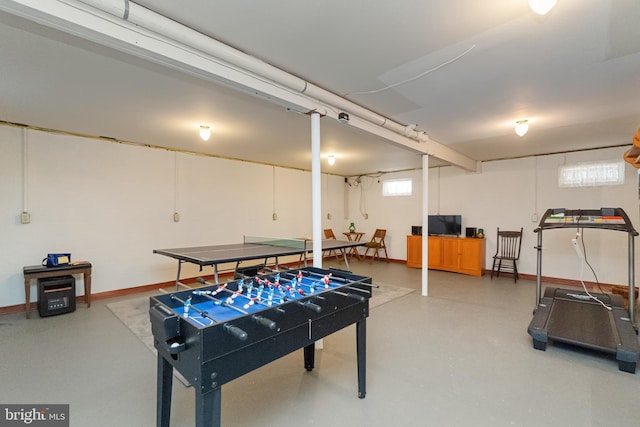 recreation room with concrete flooring