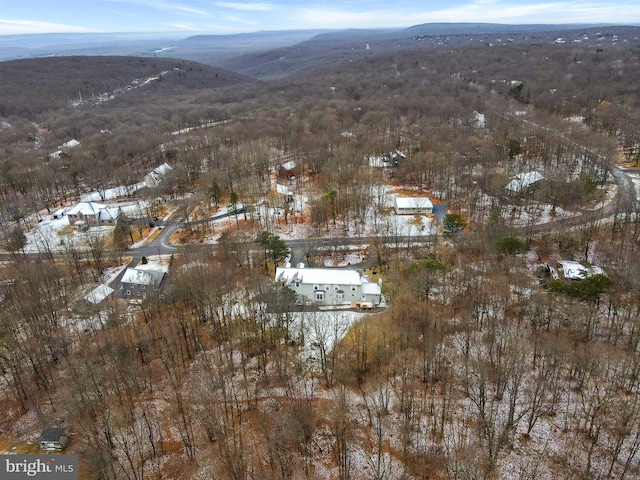 snowy aerial view with a mountain view