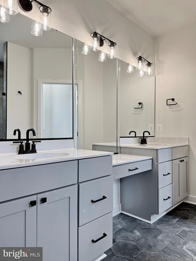 4035 Tamaron Ct, Brandywine, MD 20613 - bathroom featuring two vanities, baseboards, and stone finish flooring
