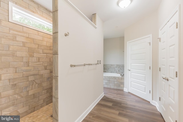 hall with dark hardwood / wood-style floors