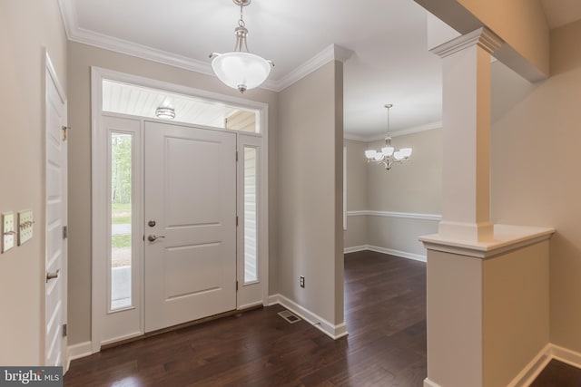 entrance foyer featuring dark hardwood / wood-style floors, a wealth of natural light, and crown molding