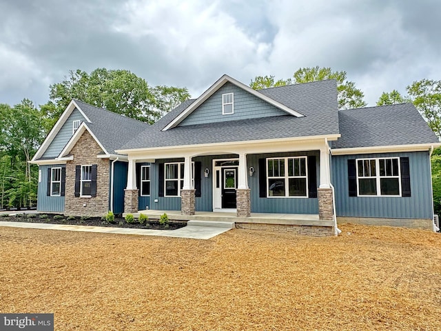 4035 Tamaron Ct, Brandywine, MD 20613 - craftsman house featuring covered porch, roof with shingles, and stone siding
