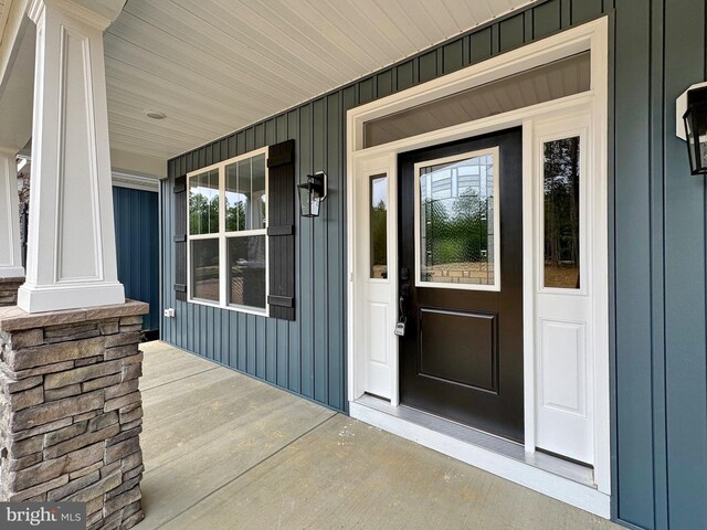 4035 Tamaron Ct, Brandywine, MD 20613 - doorway to property with a porch and board and batten siding