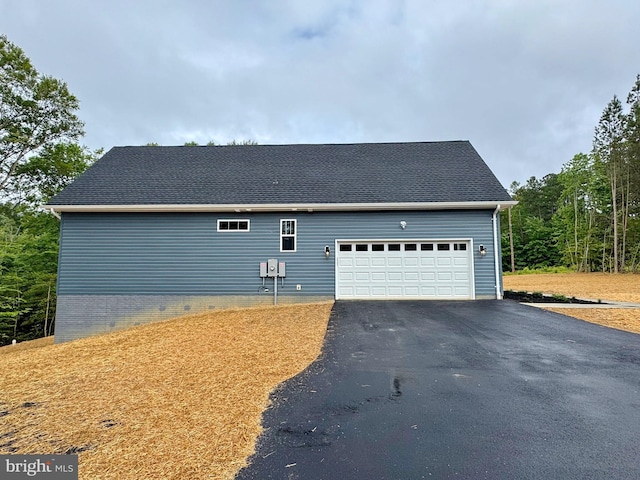 4035 Tamaron Ct, Brandywine, MD 20613 - view of side of property with asphalt driveway and an attached garage