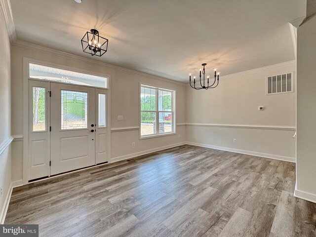 4035 Tamaron Ct, Brandywine, MD 20613 - foyer with a chandelier, wood finished floors, crown molding, and baseboards
