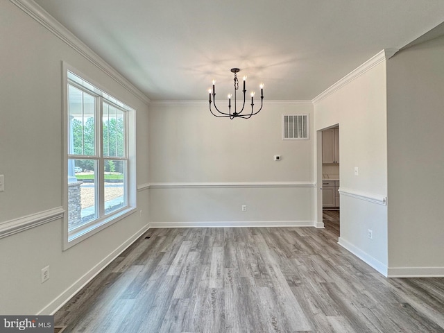 4035 Tamaron Ct, Brandywine, MD 20613 - unfurnished dining area with a chandelier, wood finished floors, crown molding, and baseboards