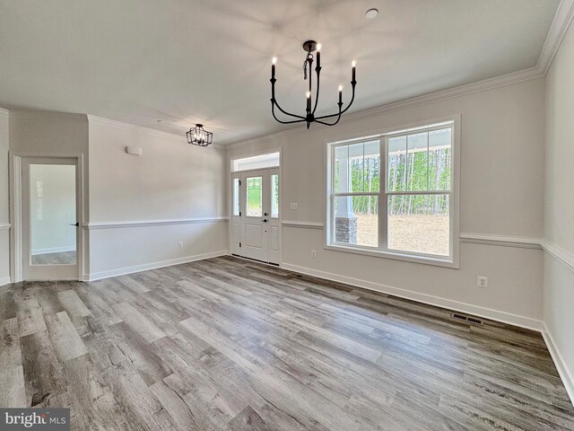 4035 Tamaron Ct, Brandywine, MD 20613 - unfurnished dining area featuring a chandelier, wood finished floors, crown molding, and baseboards