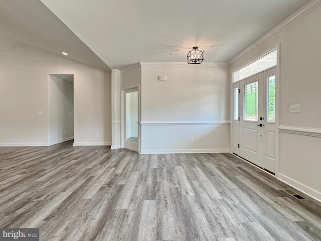 4035 Tamaron Ct, Brandywine, MD 20613 - entryway with wood finished floors, a chandelier, crown molding, baseboards, and lofted ceiling