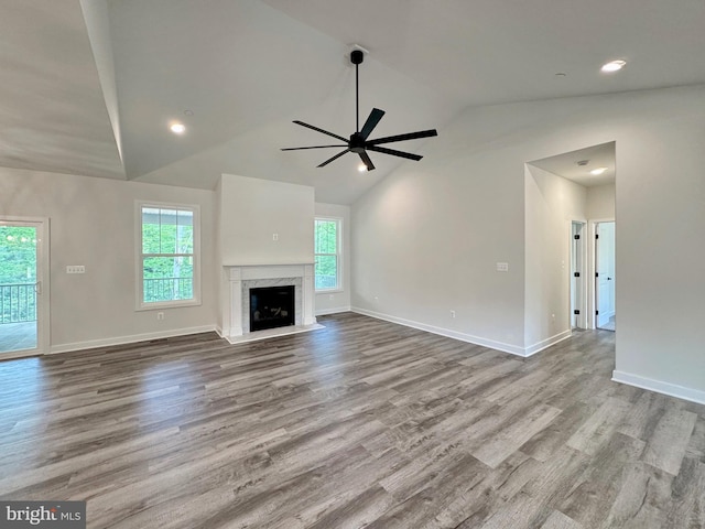 4035 Tamaron Ct, Brandywine, MD 20613 - unfurnished living room featuring ceiling fan, baseboards, wood finished floors, a high end fireplace, and high vaulted ceiling