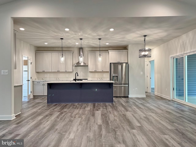 4035 Tamaron Ct, Brandywine, MD 20613 - kitchen featuring stainless steel fridge, wall chimney exhaust hood, recessed lighting, light countertops, and baseboards