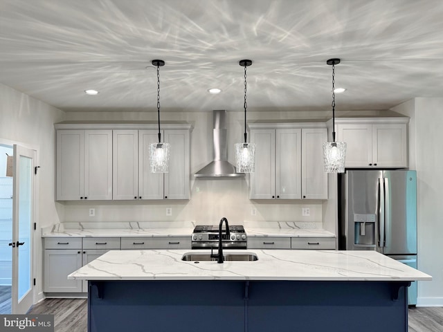 4035 Tamaron Ct, Brandywine, MD 20613 - kitchen featuring wall chimney range hood, stainless steel fridge with ice dispenser, a sink, wood finished floors, and decorative light fixtures