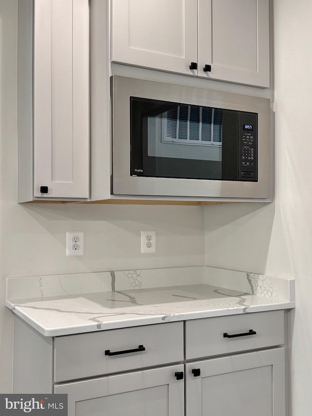 4035 Tamaron Ct, Brandywine, MD 20613 - kitchen featuring built in microwave and light stone countertops