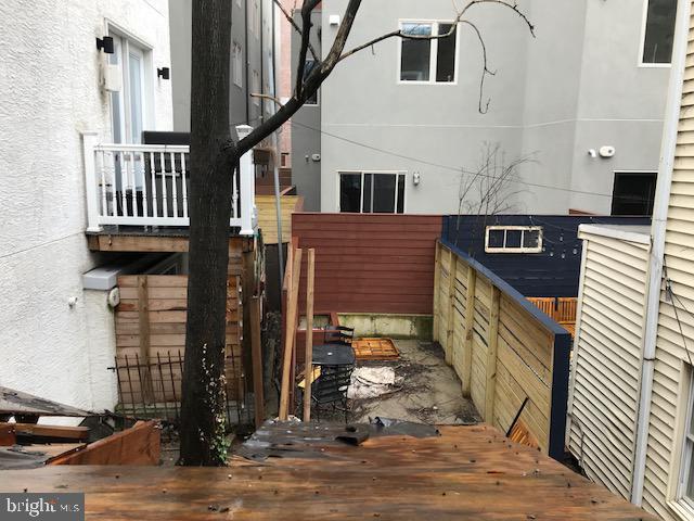 view of side of home featuring a deck