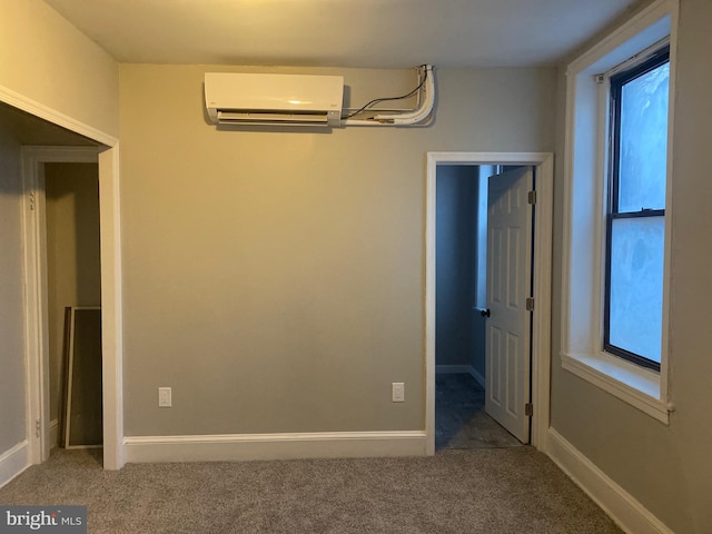 carpeted spare room with a wall mounted AC