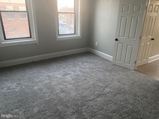 unfurnished room featuring carpet floors