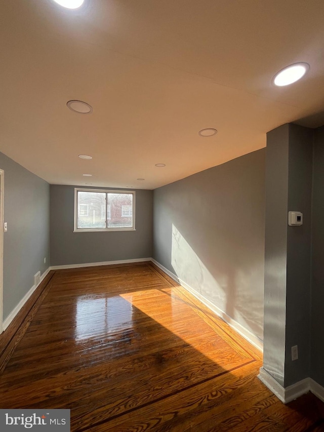 empty room with wood-type flooring