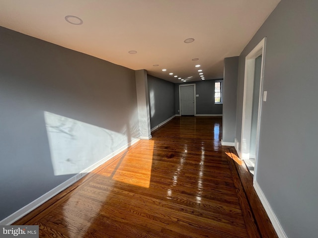 hallway featuring dark wood-type flooring