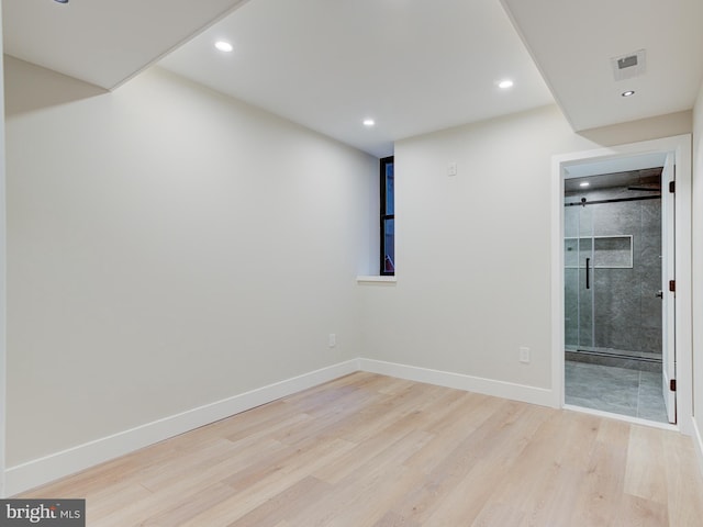 unfurnished room with light hardwood / wood-style flooring