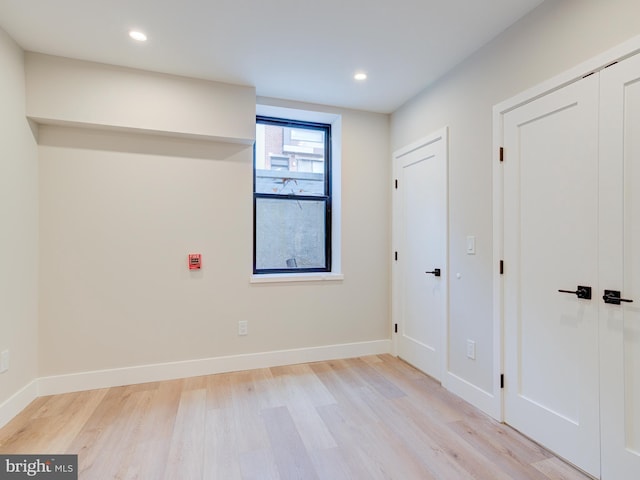 spare room with light hardwood / wood-style floors