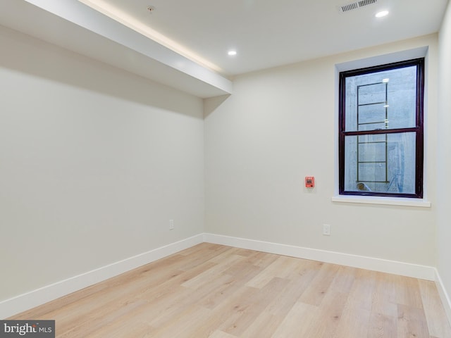 unfurnished room featuring light hardwood / wood-style floors