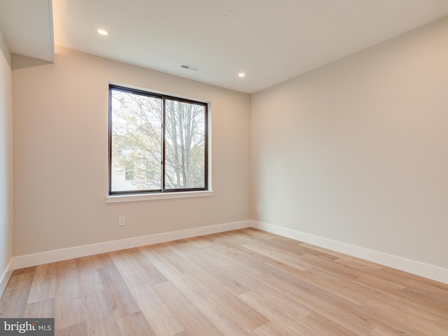 unfurnished room featuring light wood-type flooring