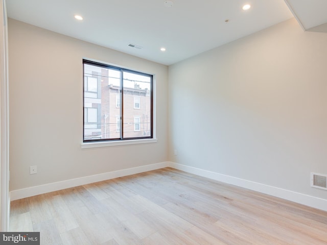 unfurnished room featuring light wood-type flooring