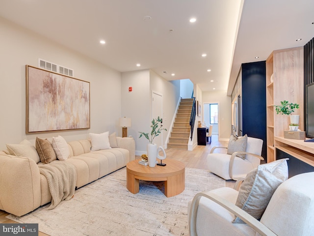 living room with light hardwood / wood-style floors