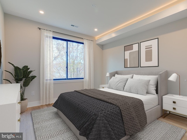 bedroom with light hardwood / wood-style flooring