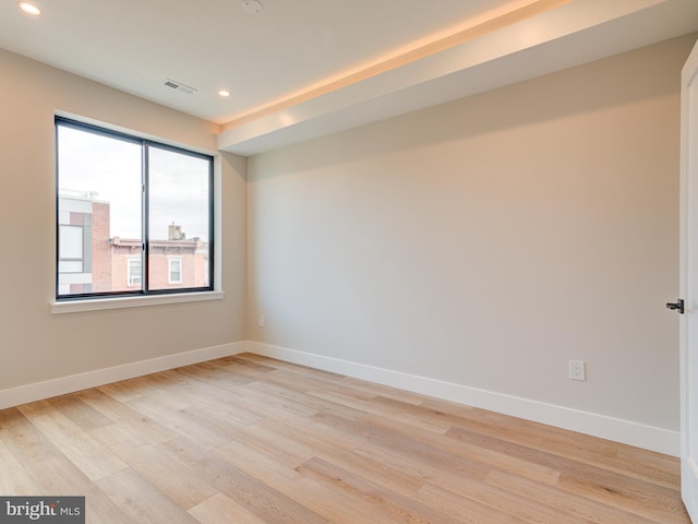 spare room with light wood-type flooring