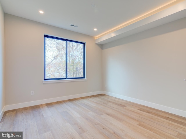 unfurnished room with light hardwood / wood-style floors