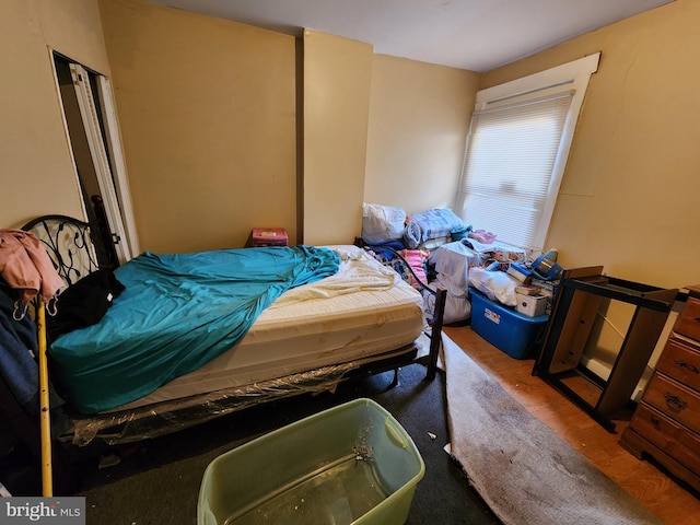 bedroom with hardwood / wood-style floors