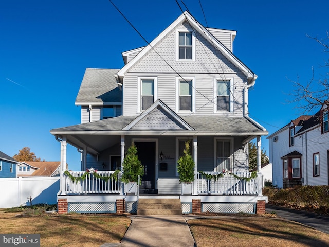 view of front facade with a porch and a front yard