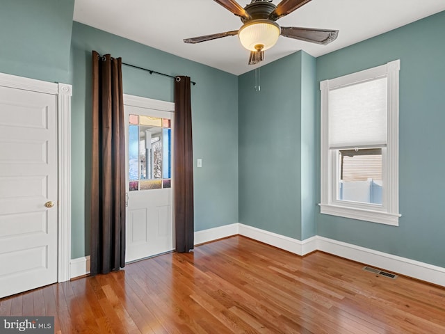 interior space featuring hardwood / wood-style floors and ceiling fan