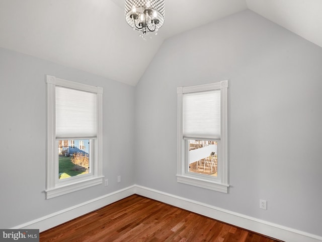 interior space featuring an inviting chandelier, plenty of natural light, and lofted ceiling