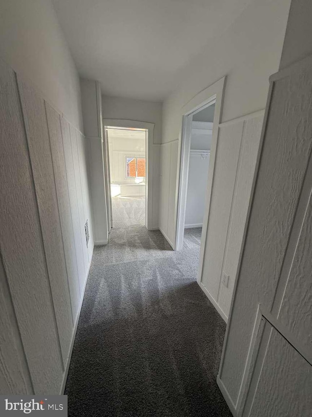 hallway with light carpet