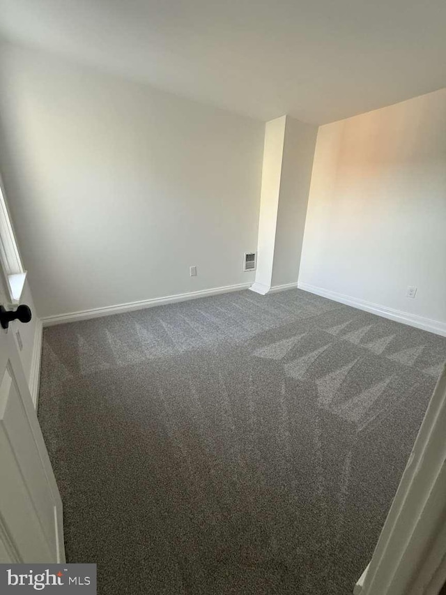 spare room featuring carpet flooring