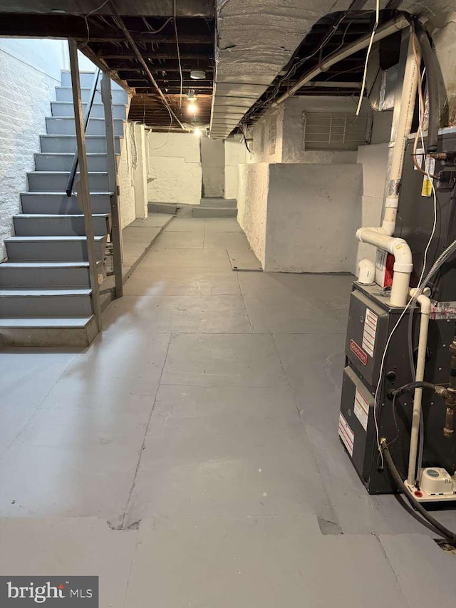 basement featuring heating unit