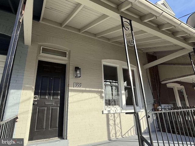 doorway to property featuring a porch