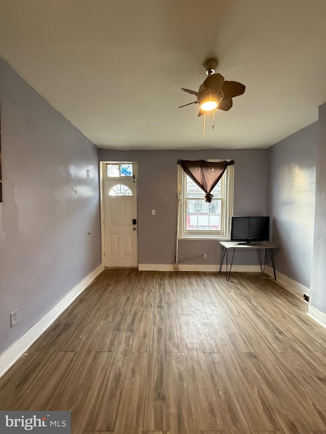 foyer with ceiling fan and hardwood / wood-style flooring