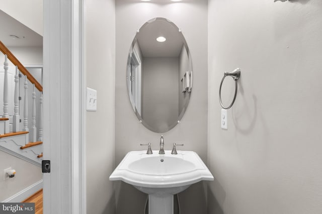 bathroom with sink and hardwood / wood-style floors