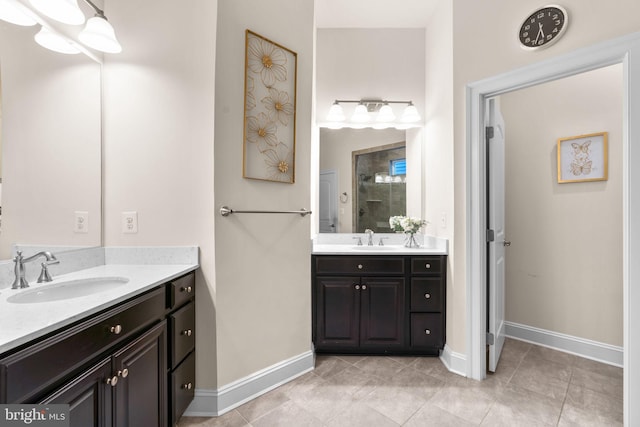 bathroom with vanity, tile patterned floors, and a shower with shower door