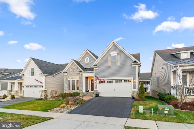 view of front of home featuring a garage and a front lawn