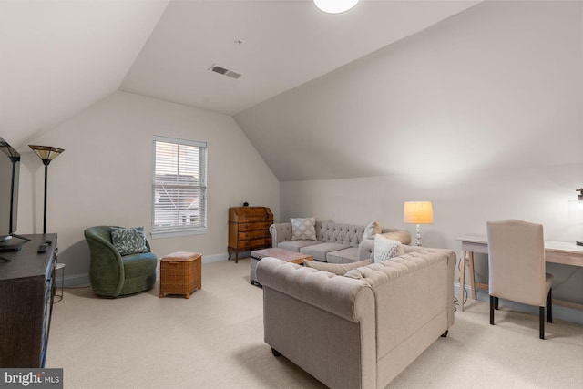 living room featuring light colored carpet and vaulted ceiling