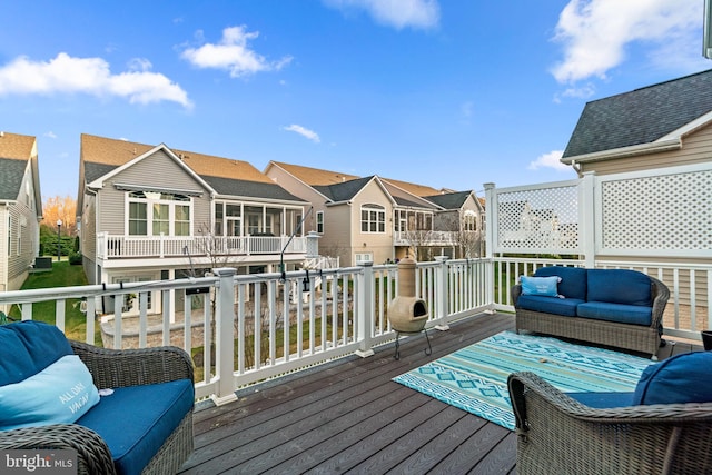 wooden deck with an outdoor hangout area