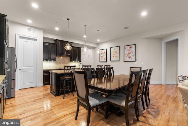 dining room with light wood-type flooring