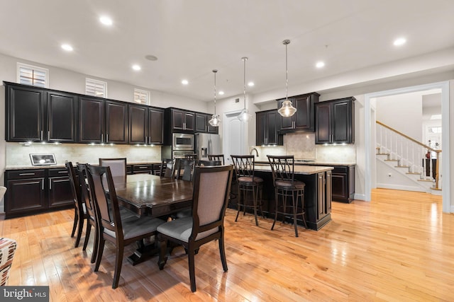 dining area with light hardwood / wood-style floors