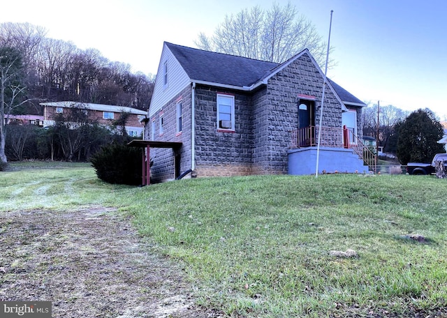 view of side of home featuring a yard