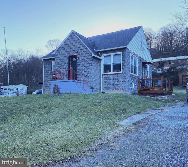 view of front of home with a yard